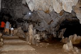 mystical cave tourists on stairs